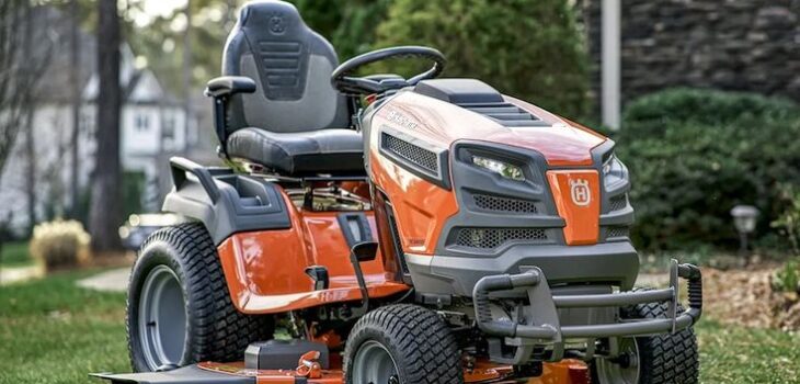 Husqvarna lawn mower cutting grass in a well-maintained garden with precision and efficiency